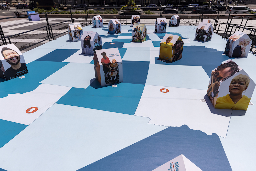 "Communities of Care" created by Artist Paola Mendoza, Illuminates the work of essential care workers at Freedom Plaza on July 13, 2021 in Washington, DC.