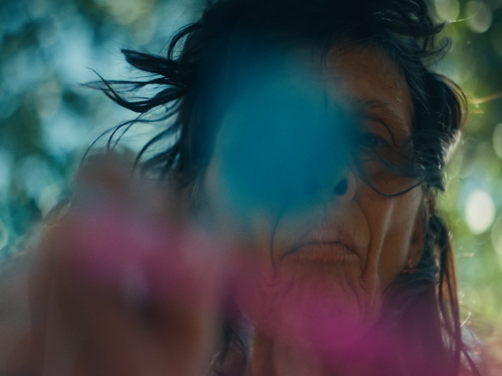 Woman with dark hair painting